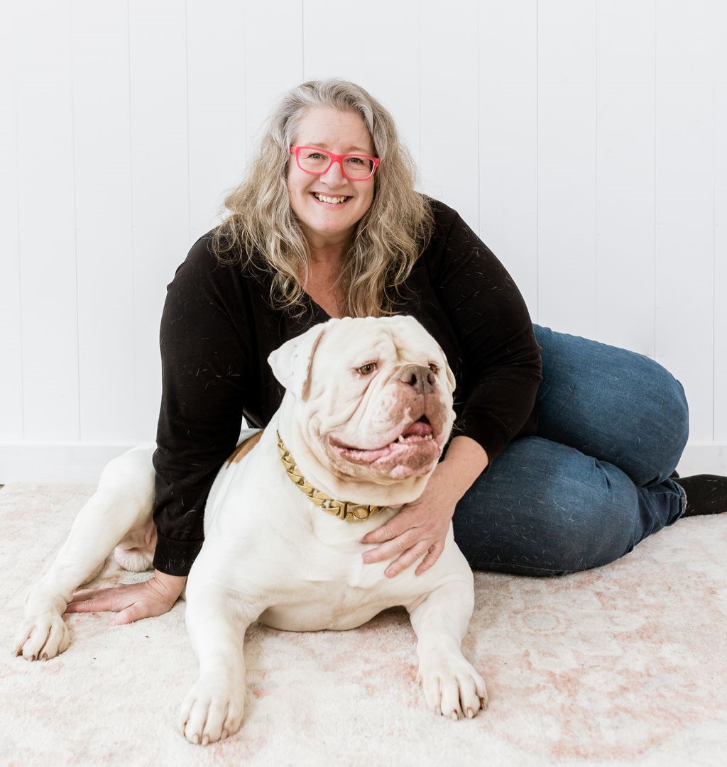 Lesli Rose, founder of The Visible Vet, with her American Bulldog Logic